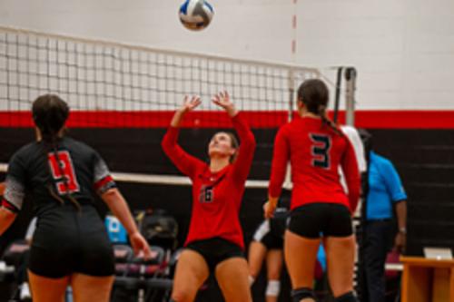 Women playing volleyball